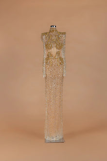 Sihëna Amber Aegis — gold high-neck long-sleeve column gown with a corseted crystal-beaded bodice.