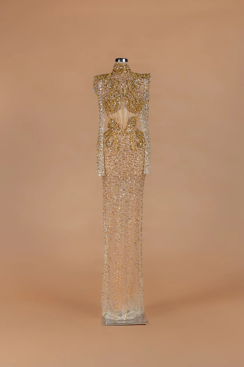 Sihëna Amber Aegis — gold high-neck long-sleeve column gown with a corseted crystal-beaded bodice.