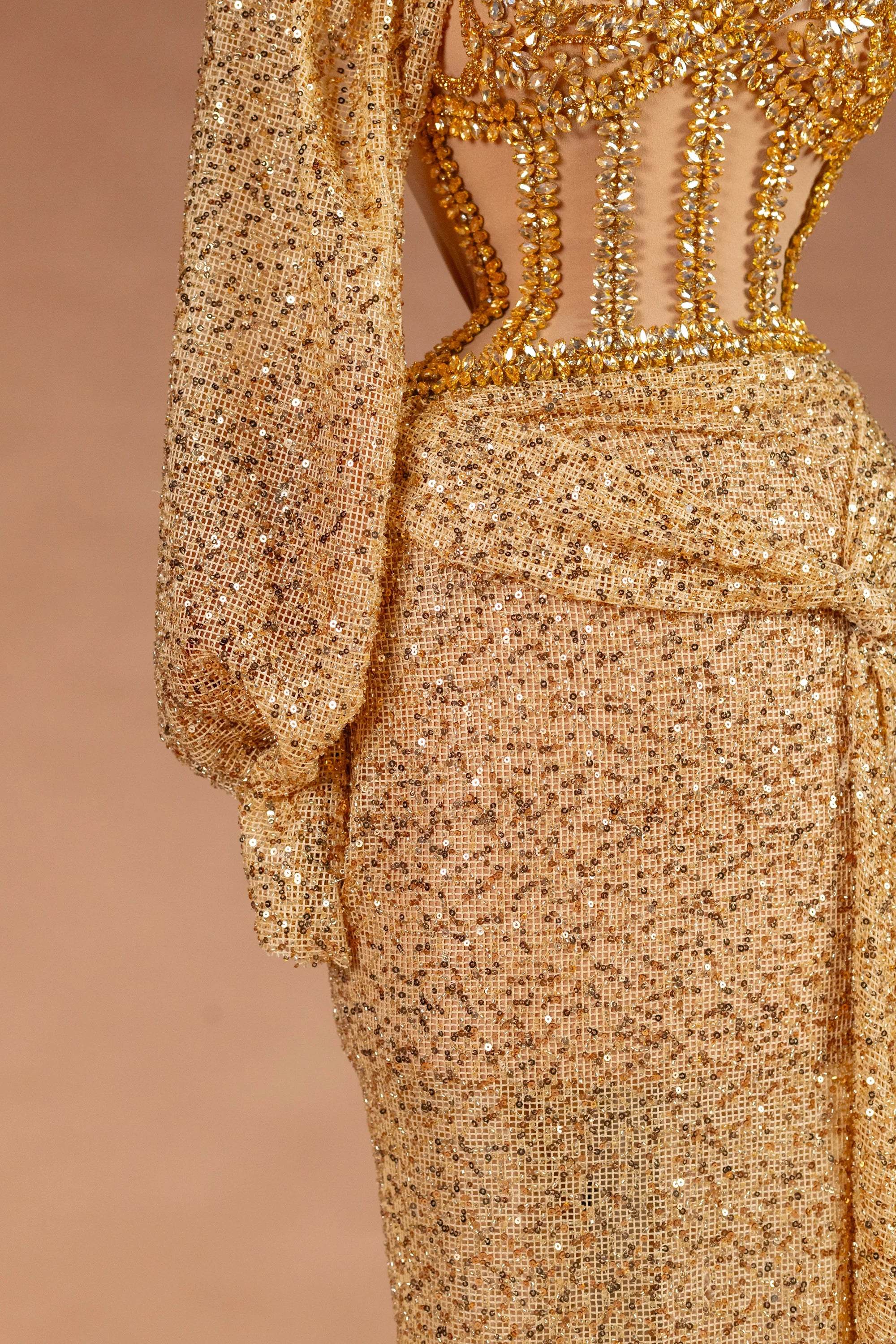 Sihëna نِثارُ الذَّهَب — gold illusion long-sleeve fitted evening dress