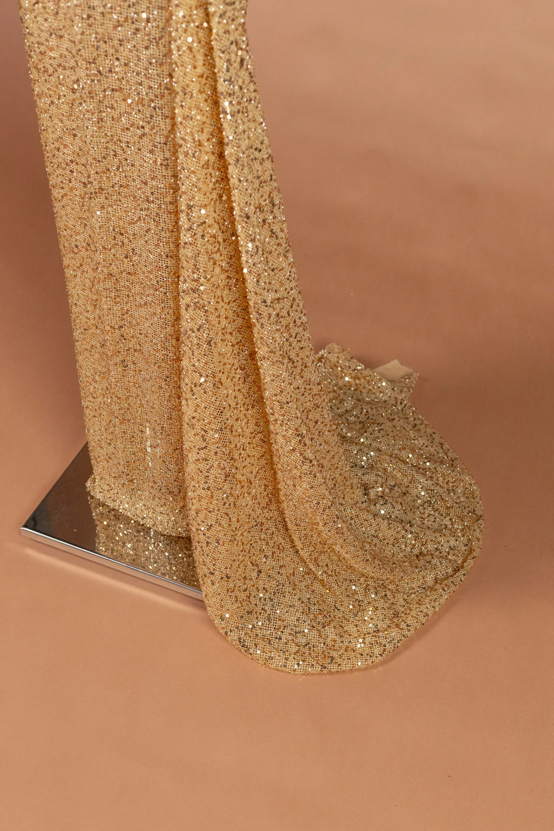 Sihëna نِثارُ الذَّهَب — gold illusion long-sleeve fitted evening dress