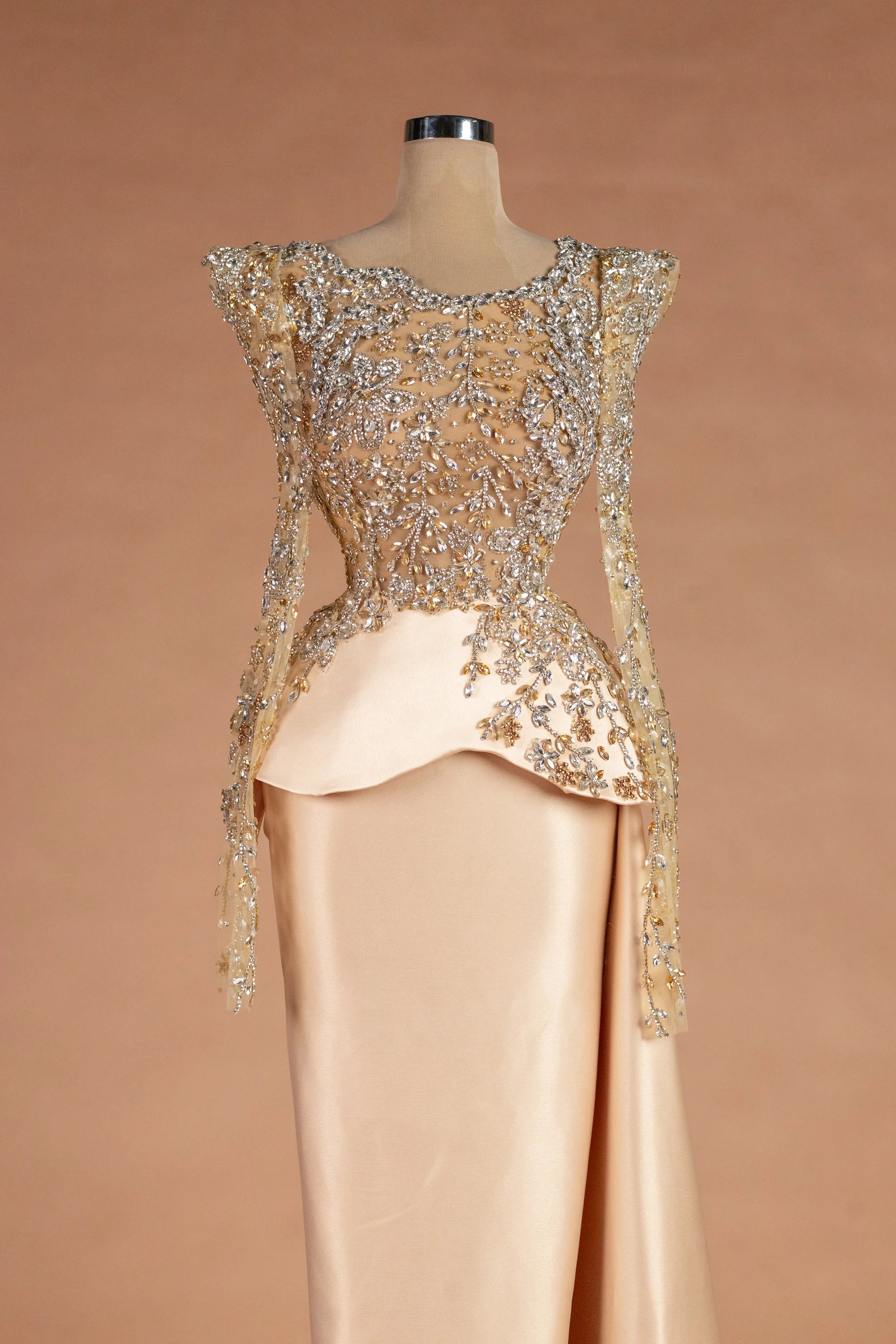Sihëna شمسُ الشتاء — champagne illusion long-sleeve column evening dress