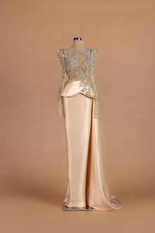 Sihëna Auric Solstice — champagne illusion long-sleeve column gown with a crystal-embroidered bodice.