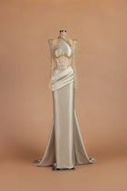 Sihëna Candlelight Fanfare — champagne illusion long-sleeve column gown with crystal beadwork.