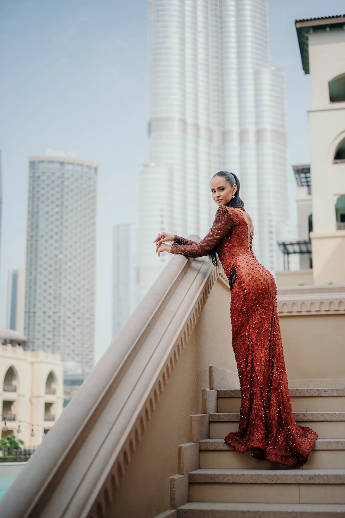 Sihëna Carnelian Sarabande — rust high-neck long-sleeve mermaid evening dress