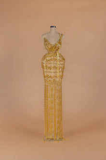 Sihëna Gilded Parure — gold asymmetric sleeveless column gown with draped crystal bead strands.