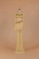 Sihëna Golden Nectar — gold strapless long-sleeve mermaid gown with crystal-beaded corset cutout waist.