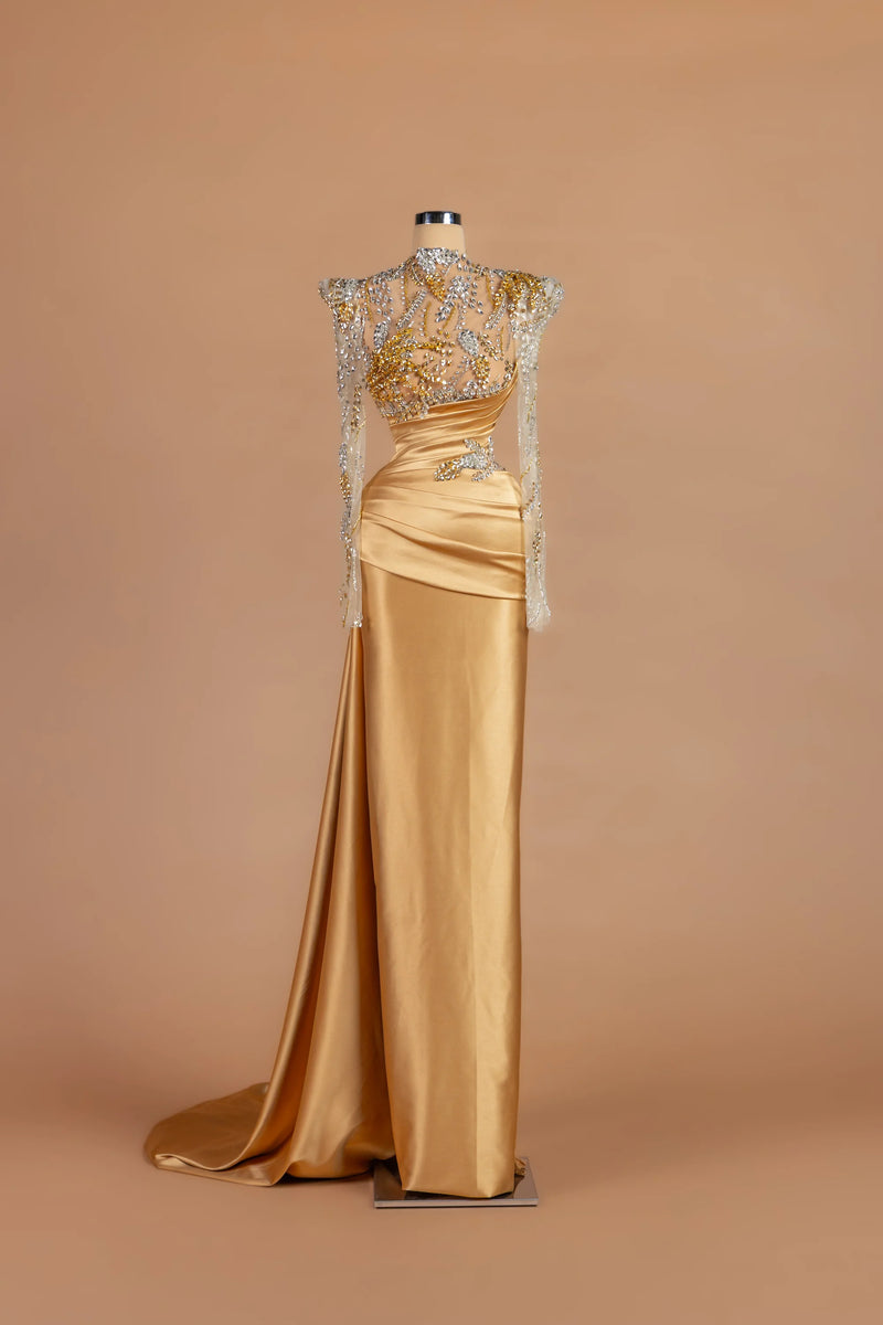 Sihëna Goldleaf Regent — gold high-neck long-sleeve column gown with leaf-motif crystal embroidery.