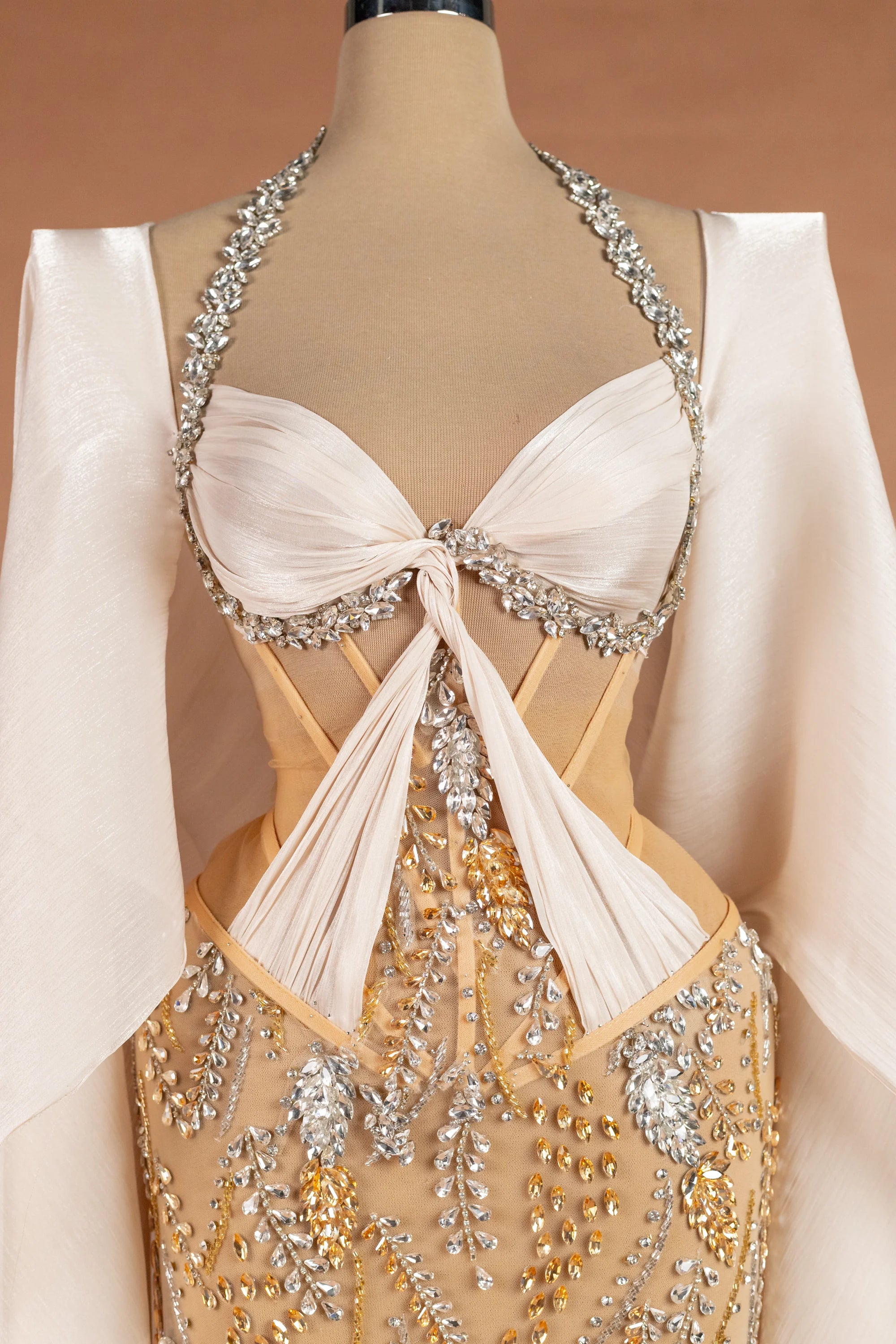 Sihëna غَلالَةُ القَمَر — champagne halter cape-sleeve column evening dress