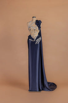 Sihëna Ink Rose — navy asymmetric sleeveless column gown with 3D floral detailing.