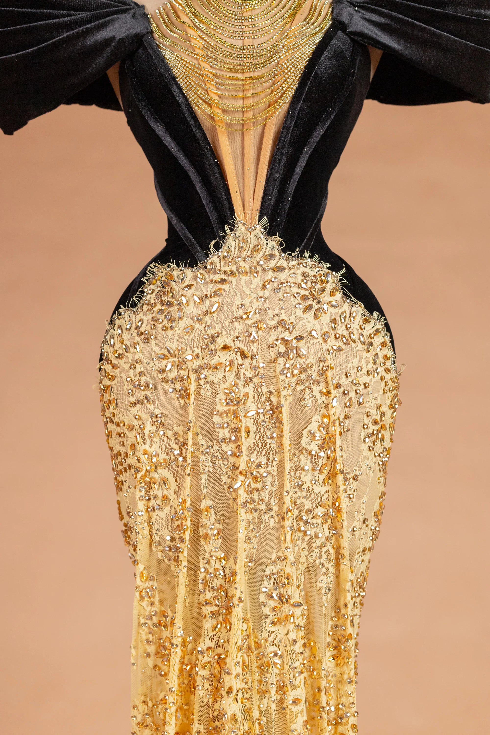 Sihëna عِقْدُ الليلِ الذهبيّ — gold v-neck off-shoulder mermaid evening dress
