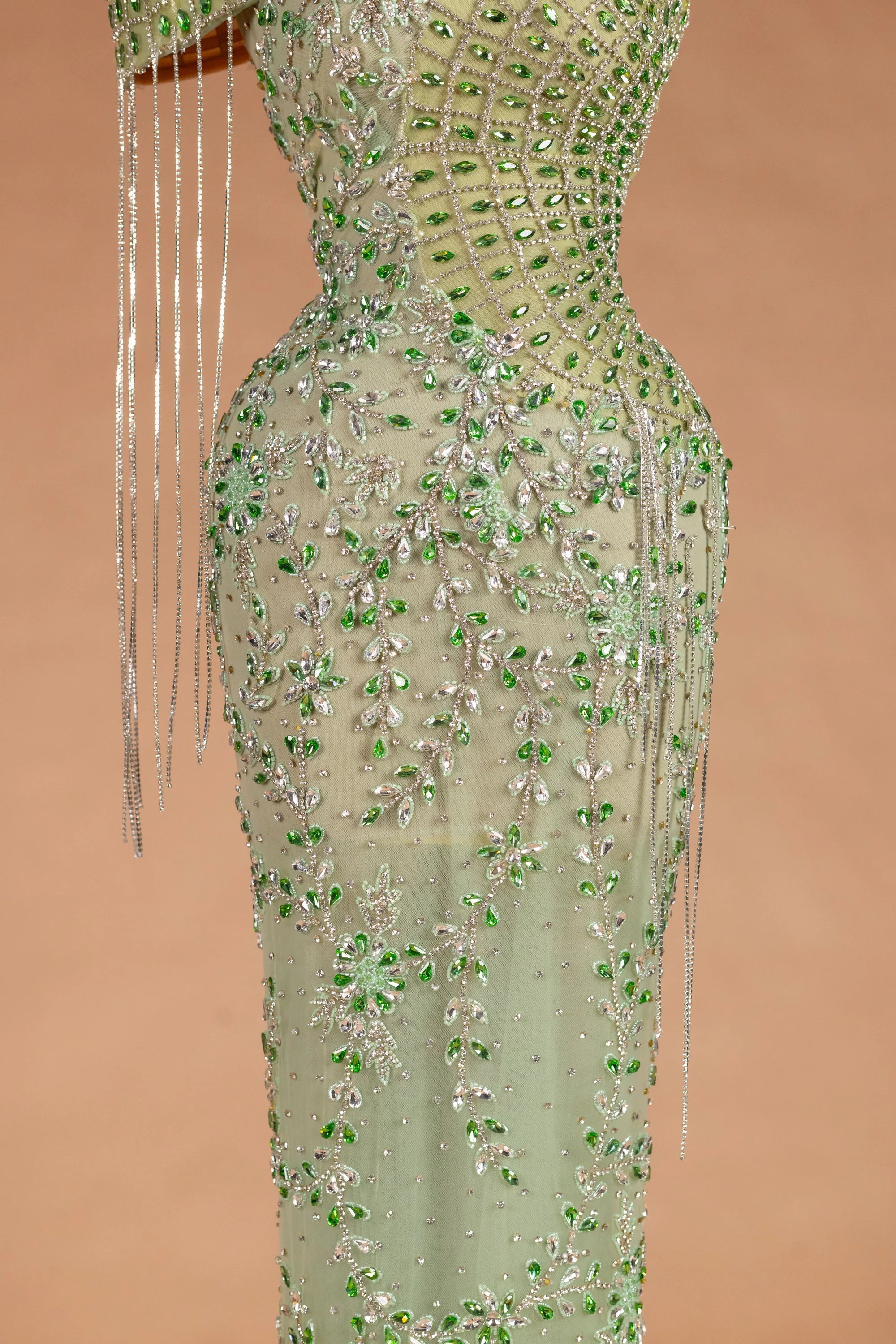 Sihëna عين الطاووس — sage-green asymmetric sleeveless mermaid evening dress