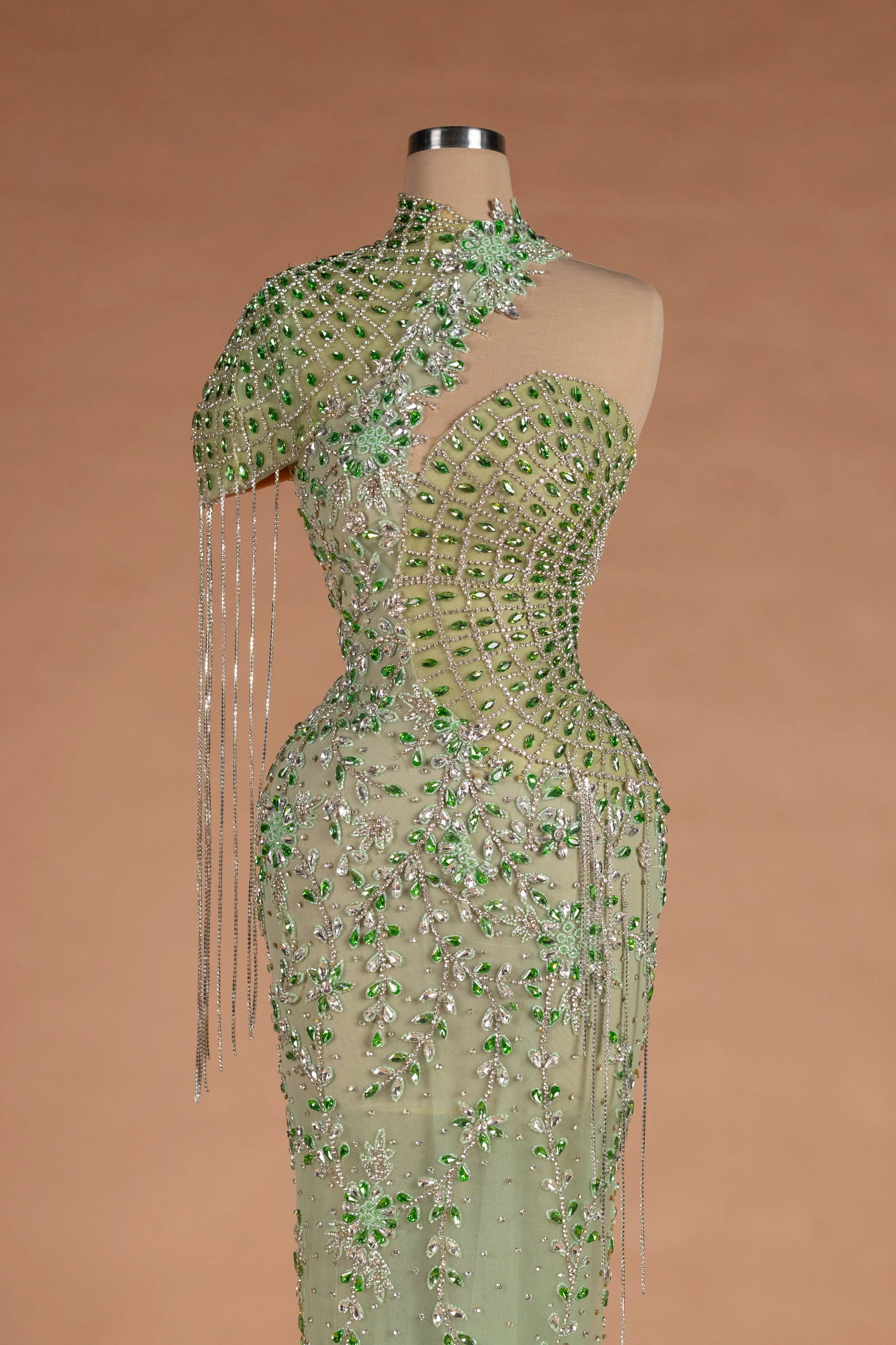 Sihëna عين الطاووس — sage-green asymmetric sleeveless mermaid evening dress