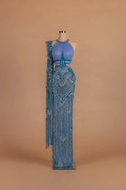 Sihëna Periwinkle Sunburst — powder-blue halter sleeveless column gown with radiating crystal beadwork.