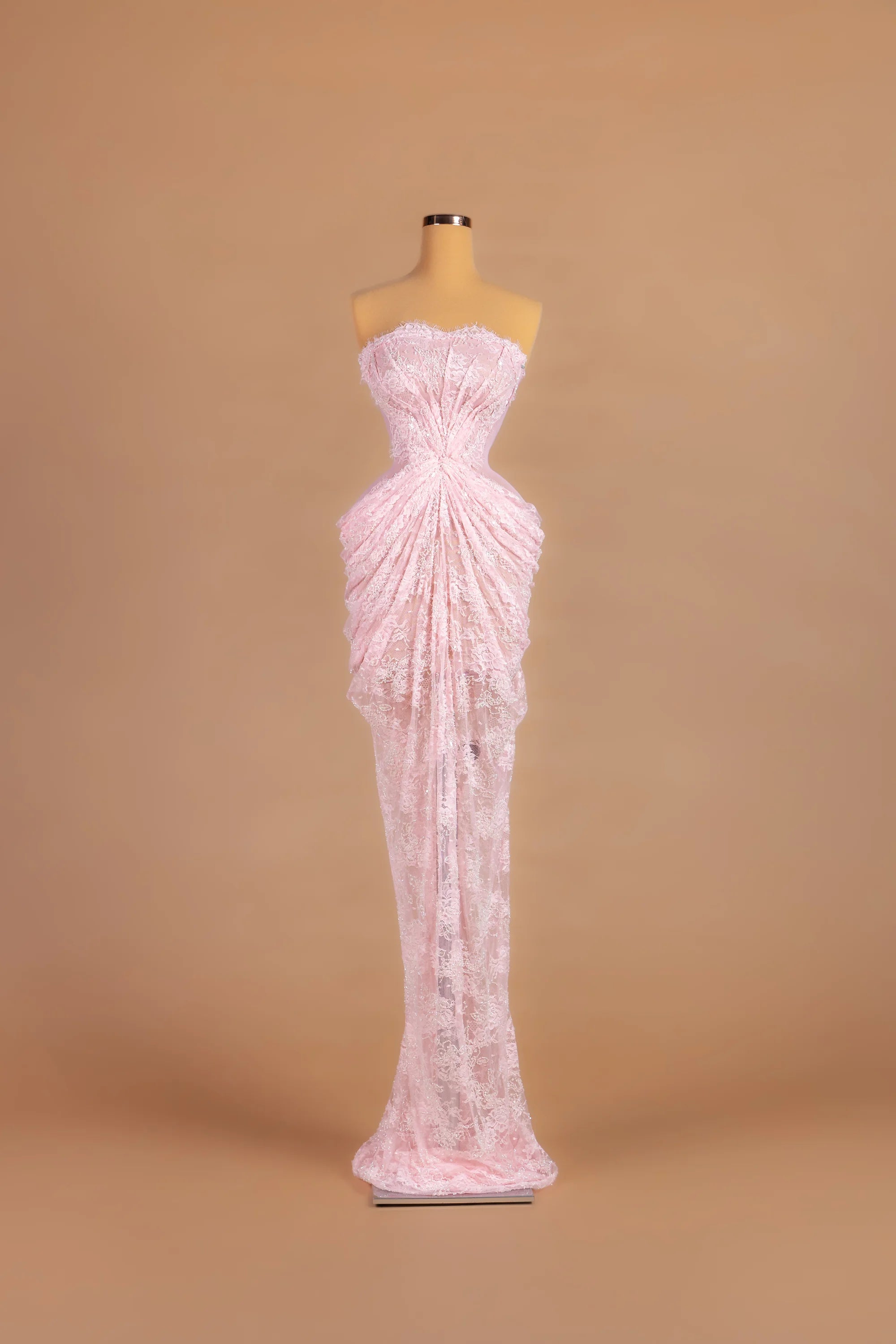 Sihëna Rosewater Mist — pink strapless sleeveless sheath gown with draped lace detailing.