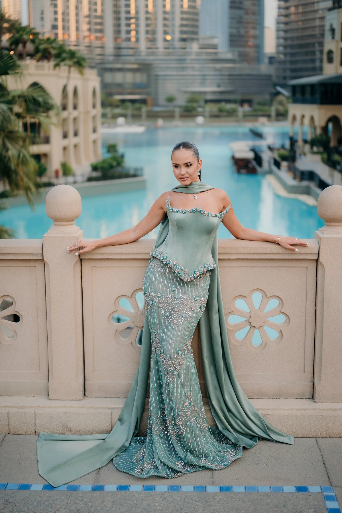 Sihëna لُؤْلُؤُ المَرْج — sage-green square spaghetti-strap column evening dress