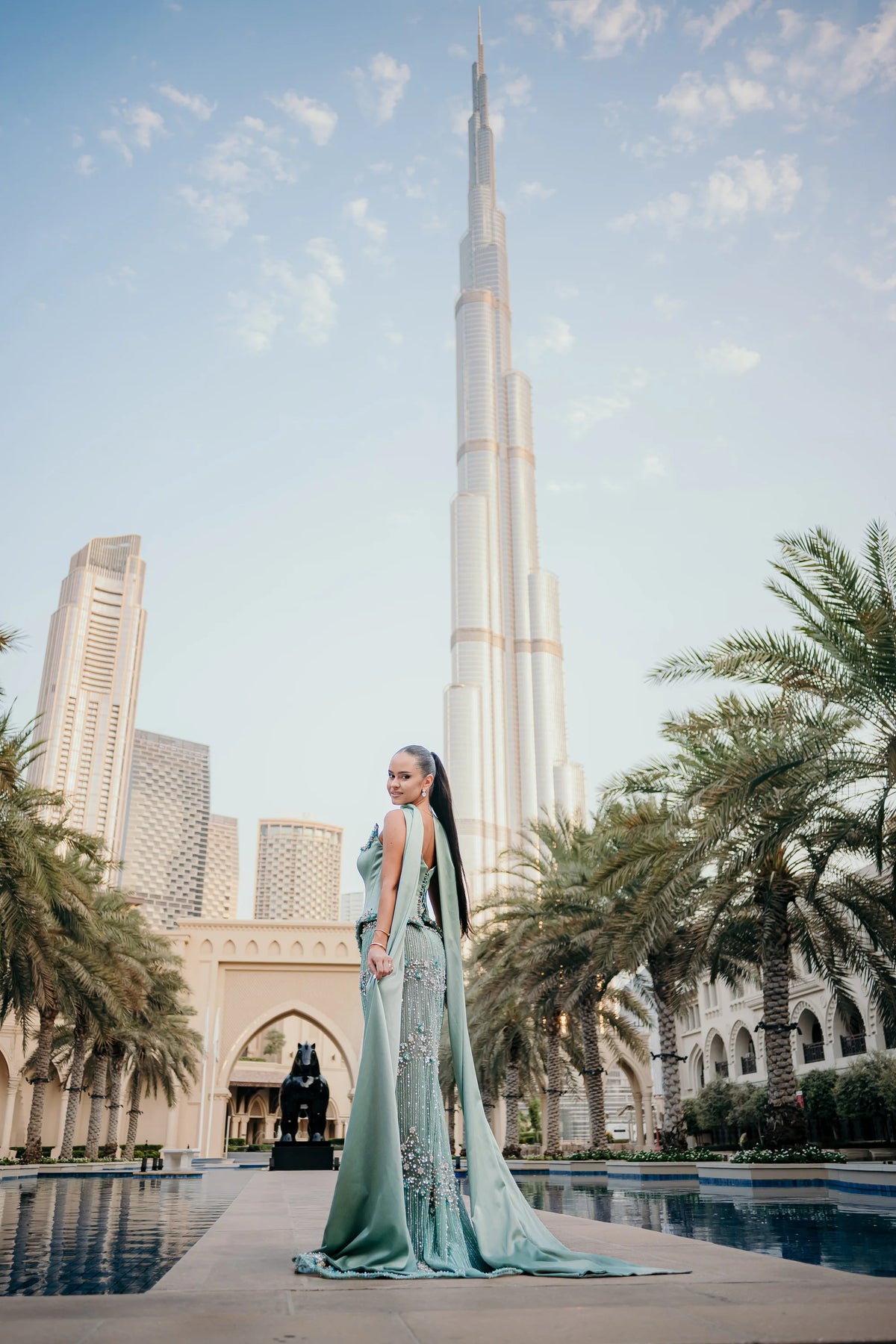 Sihëna لُؤْلُؤُ المَرْج — sage-green square spaghetti-strap column evening dress