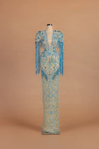 Sihëna Turquoise Tide — teal v-neck short-sleeve column gown with beaded embroidery.