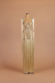 Sihëna Vermeil Chandelier — champagne illusion-neck sleeveless column gown with cascading fringe over crystal embroidery.